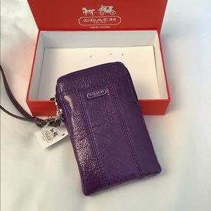 Purple coach wristlet wallet.